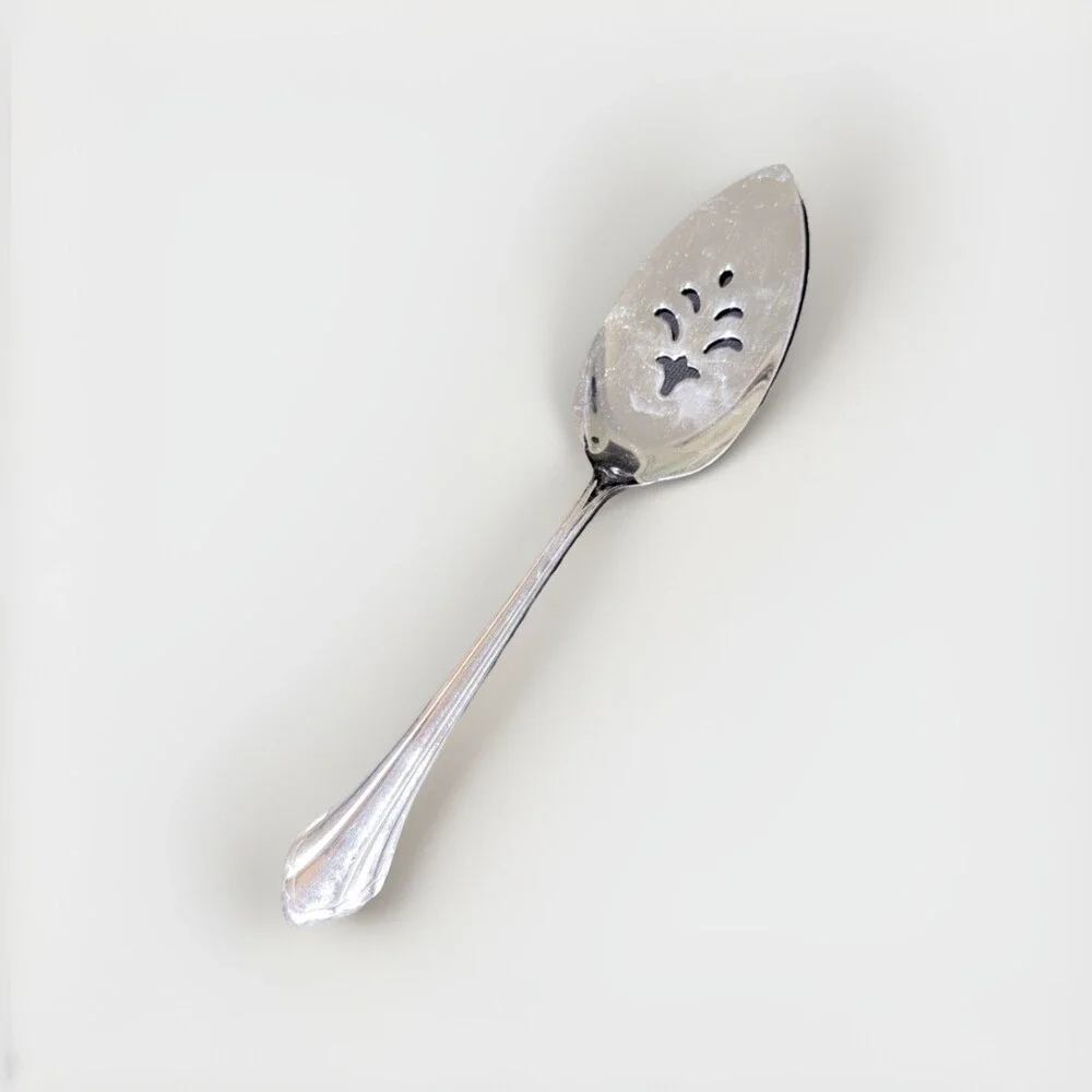 Oneida Community Royal Flute pierced pie server in stainless steel. 9.5”
